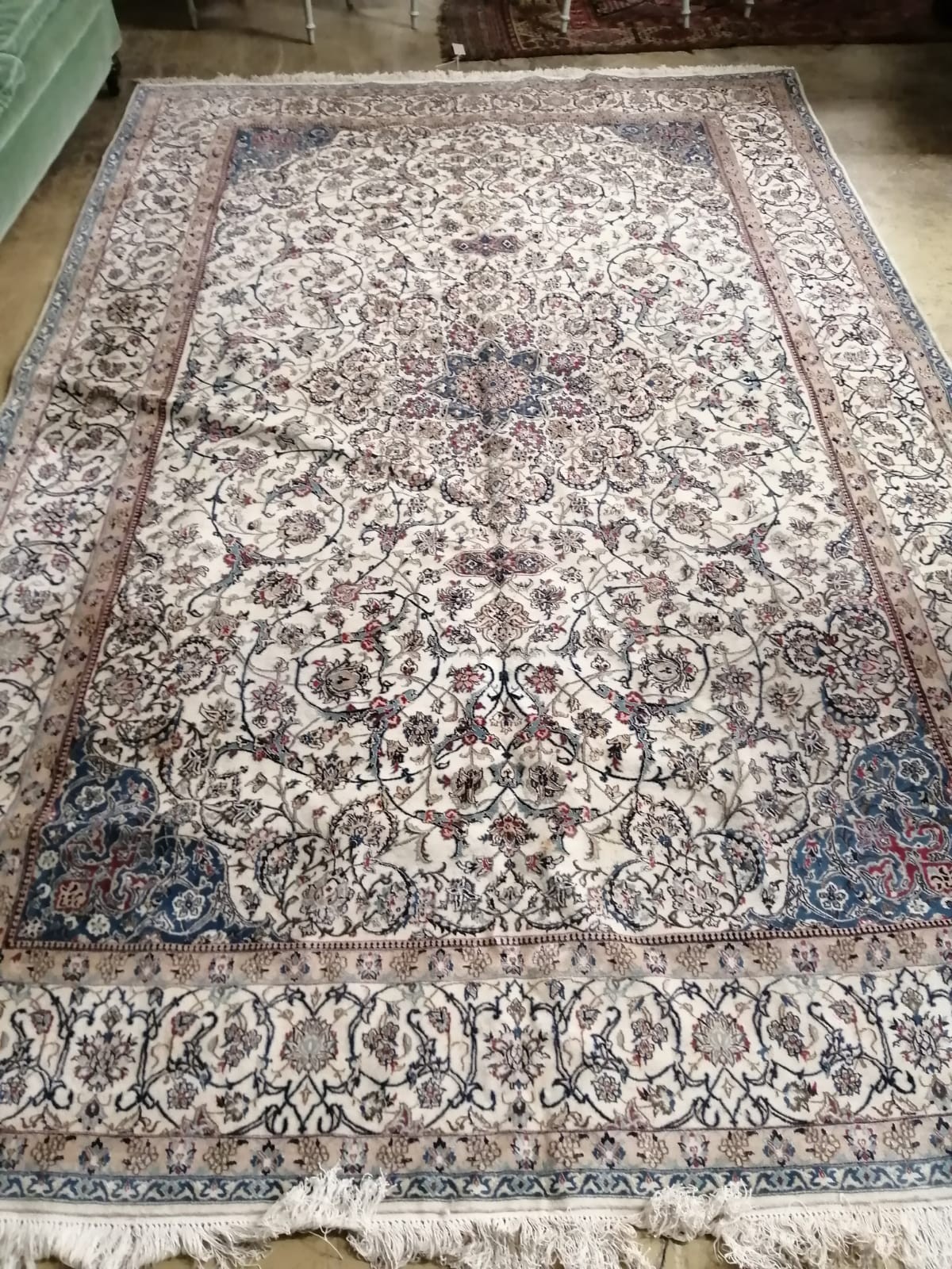 A Tabriz ivory ground carpet, 310 x 206cm